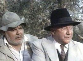 Warren Berlinger and Pleasence watch in horror